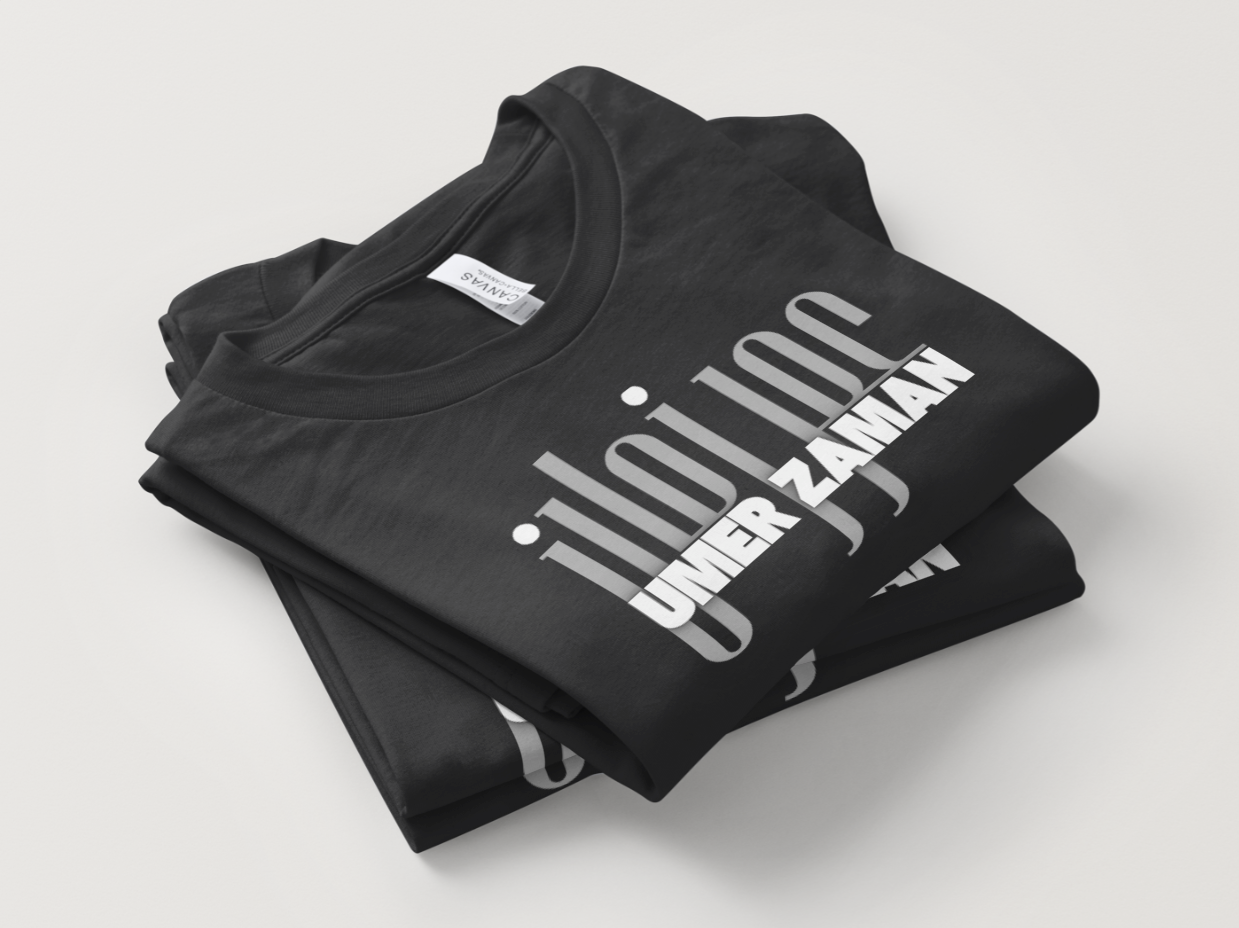 Black t-shirt with white text on a light gray background